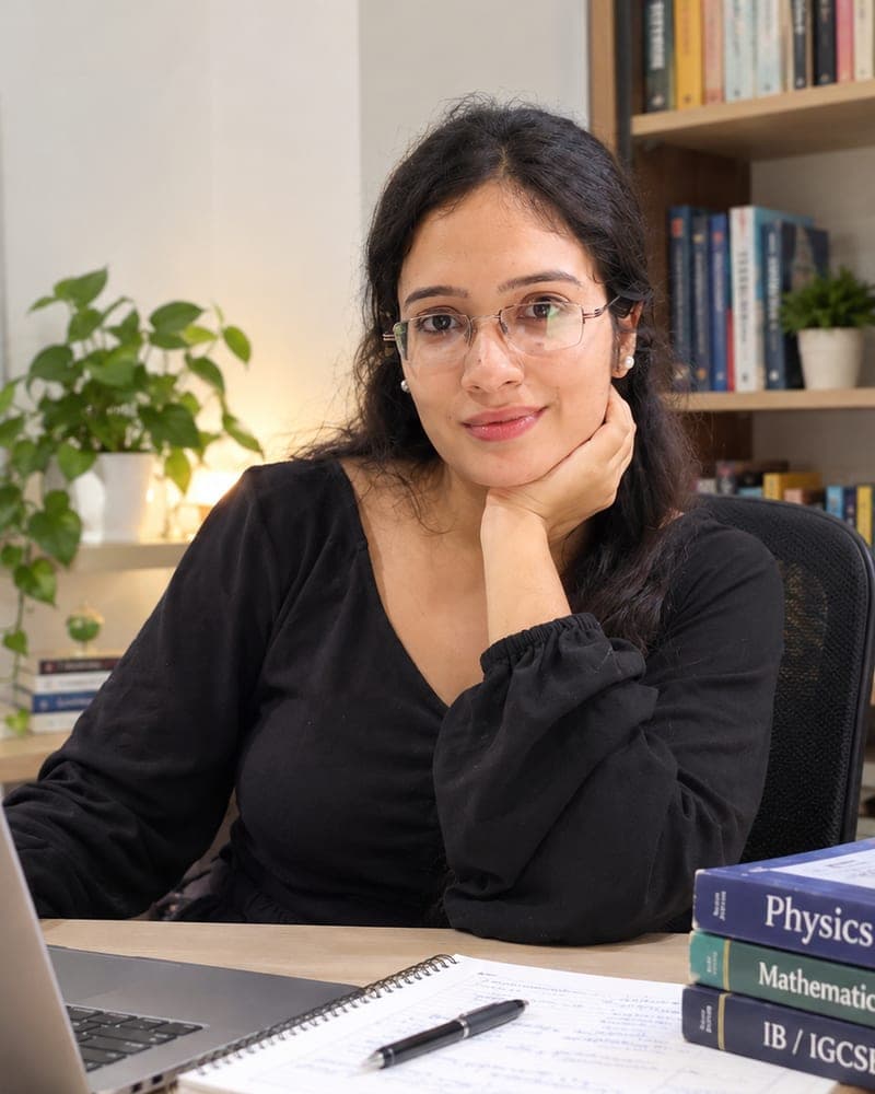 Deepayan Srivastava at a desk with Physics, Mathematics and IB/IGCSE books